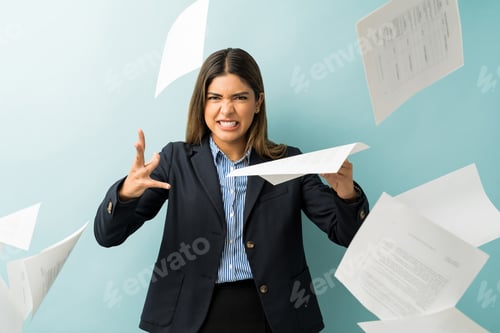 Preview: Angry Businesswoman With Papers At Studio