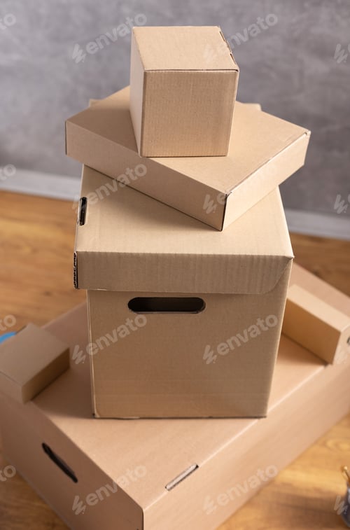 Preview: Stack of cardboard box on floor. Cardboard boxes for moving to new home. Relocation concept