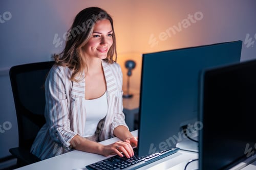 Preview: Woman working overtime in an office