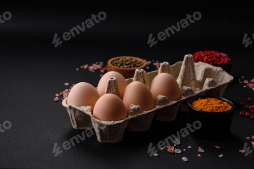 Preview: Fresh raw chicken eggs in beige color in a cardboard tray