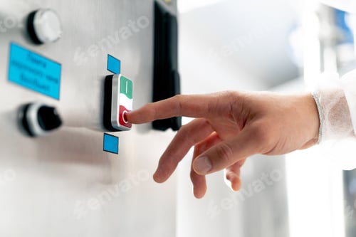 Preview: Close-up shot of a man's hand pressing the on and off button on fermentation machine with his finger