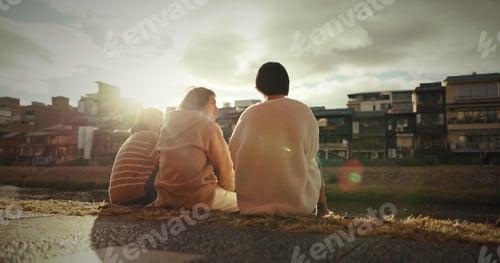 Preview: Friends, sitting and talking in city on sidewalk with travel, gen z and happy discussion together i