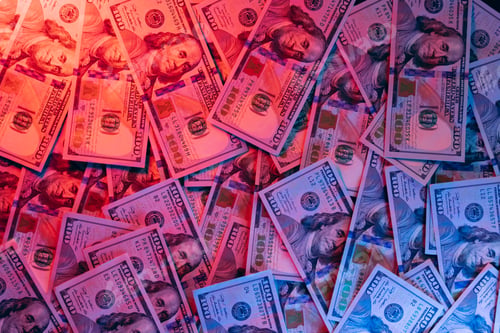 Preview: Money background enlighten by red and blue light
