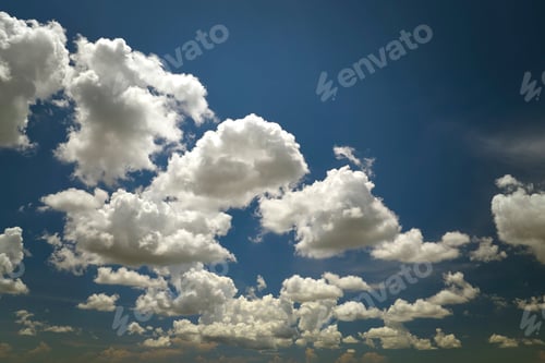 Preview: White puffy cumulus clouds on summer blue sky