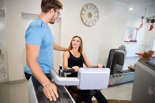 Preview: Instructor praises the client on the strength training machine