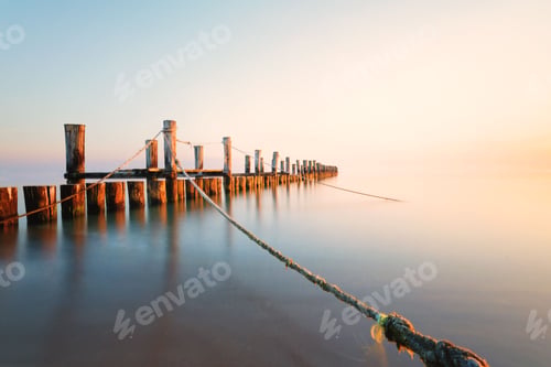 Preview: Beautiful scene of long wooden pie over water with blur bright sky in Zingst by Baltic Sea