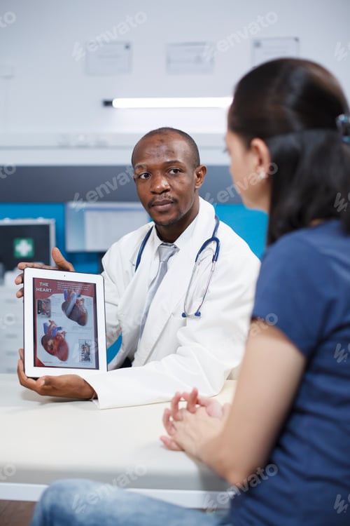 Preview: Physician holds tablet with heart image