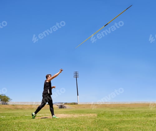 Preview: this is going the distance. Shot of a lone man throwing a javelin outside.