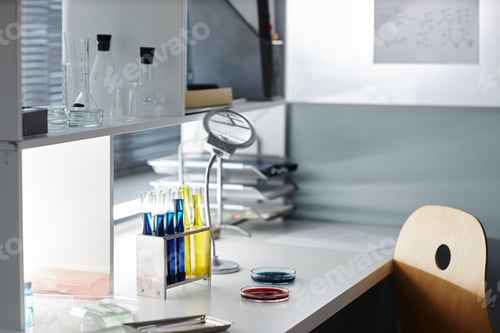Preview: Laboratory equipment on workstation with petri dishes and test liquids
