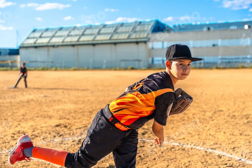 Preview: Youth baseball player pitching during a game