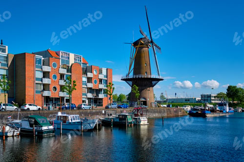 Preview: View of the harbour of Delfshaven and the old grain mill De Destilleerketel. Rotterdam, Netherlands