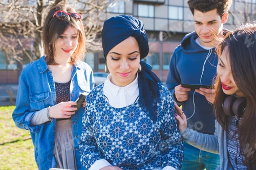Preview: Multiracial group young people using computer