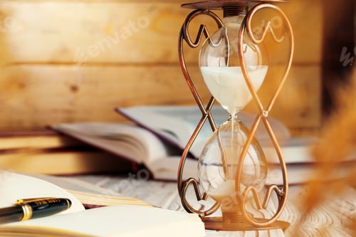 Preview: Hourglass with sand close up on wooden background