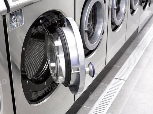 Preview: Industrial washing machines in a public laundromat