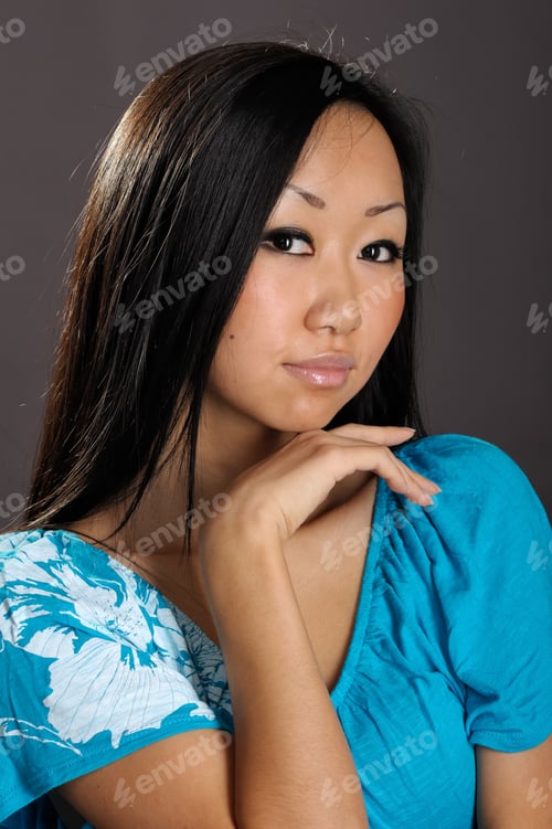 Preview: Portrait Of Cute Female Fashion Model Posing On Dark Background