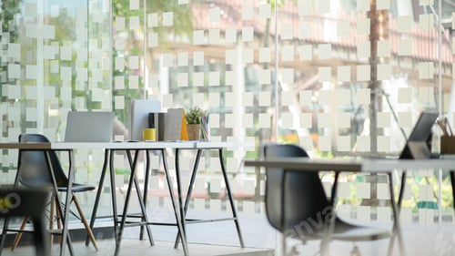 Preview: Modern workplace with laptop computer and office supplies.