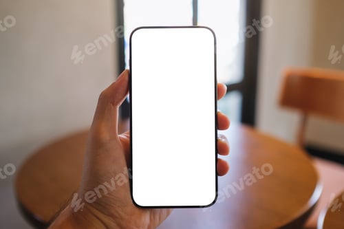 Preview: Mockup image of a man holding mobile phone with blank white screen in cafe