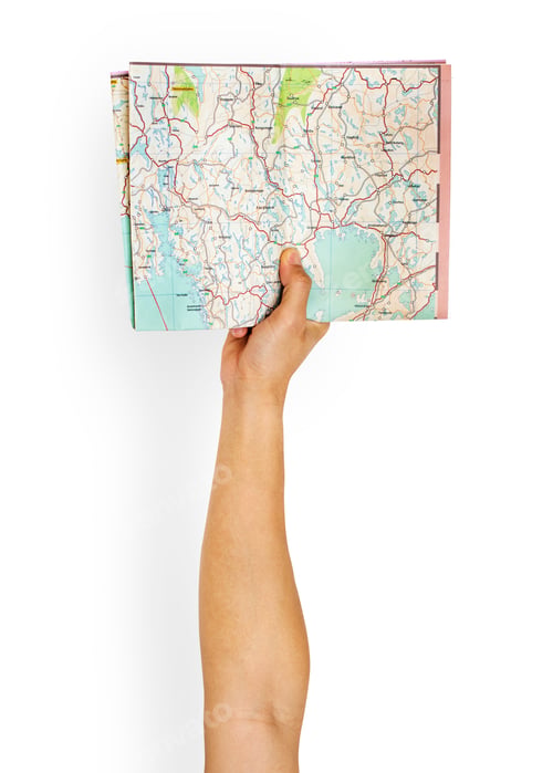 Preview: Hand holding map isolated on background
