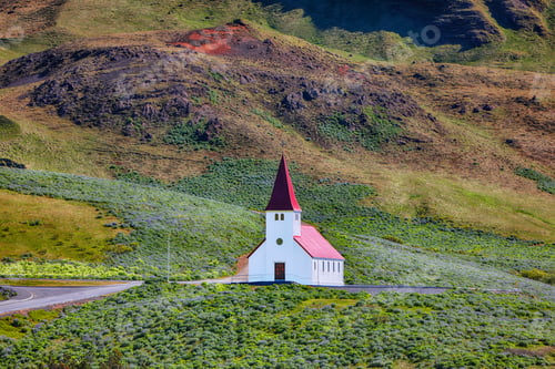 Preview: Impressive view of Vikurkirkja christian church in front of mouintain