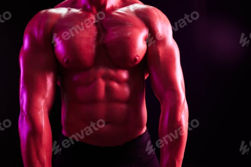 Preview: Man professional bodybuilder athlete naked torso in sports, isolated on multicolored background in
