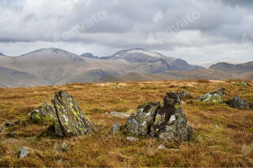 Preview: landscape with large boulders in the foreground in the Moel Eilio summit plateau across to Yr Wyddfa