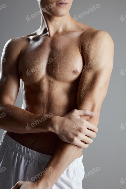 Preview: athletes with a pumped-up torso and in white shorts cropped view on a gray background