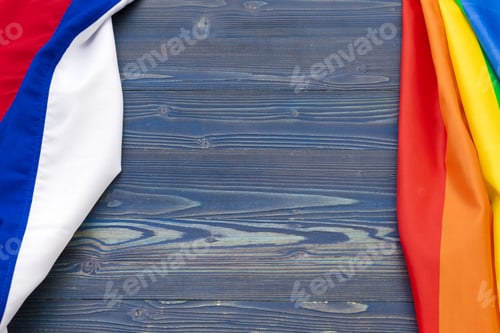 Preview: Russian and Gay pride flags placed side by side. Concept of gay rights