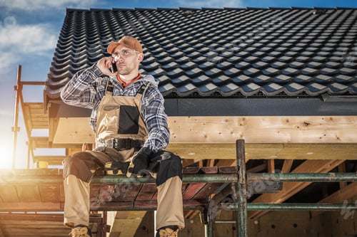 Preview: Construction Worker on Phone Call Break at Building Site
