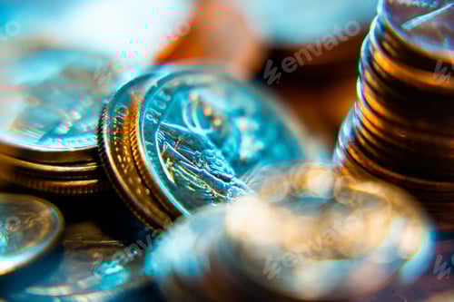 Preview: Nickels dimes and quarters with a shallow depth of field and selective focus about to collapse