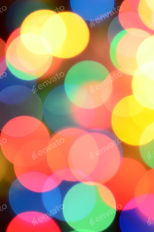 Preview: Blurred festive colorful lights over black useful as background