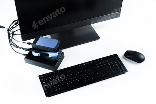 Preview: Multiple external hard drives connected to a monoblock on a white background.Computer with hard