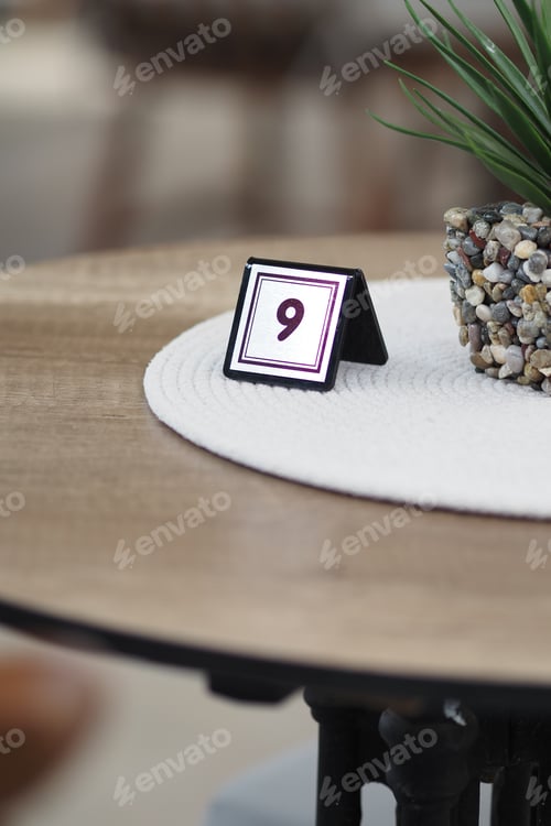 Preview: Table number nine stands at a cafe during lunch hour