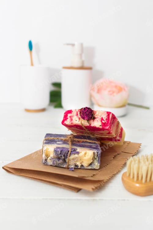 Preview: Handmade natural soap with rose and lavender on wooden background