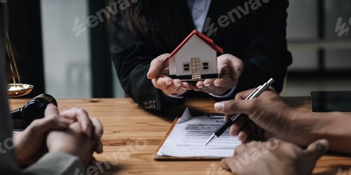 Preview: Discussion with a real estate agent, House model with agent and customer discussing for the contract