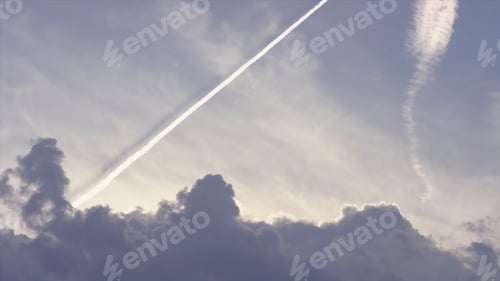Preview: Large passenger supersonic plane flying high in clear blue sky, leaving long white trail. Airplanes