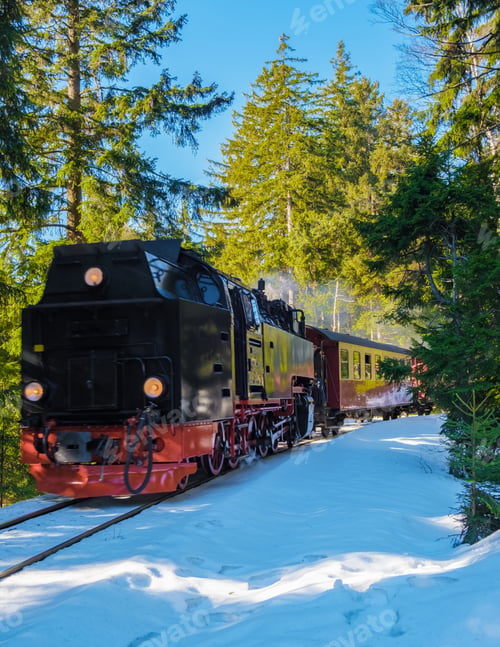 Preview: Steam train during winter in the snow in the Harz Germany Brocken Bahn