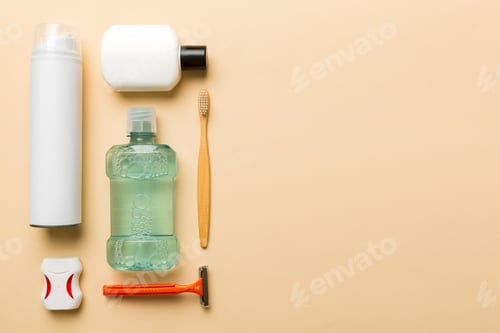 Preview: Composition with bath cosmetics on table. razor, toothpaste, soap, gel, toothbrush,