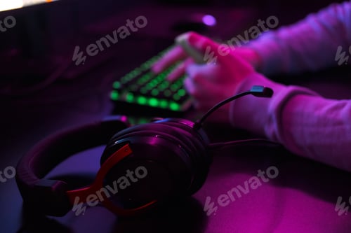 Preview: Close up of gaming headphones with microphone in neon light