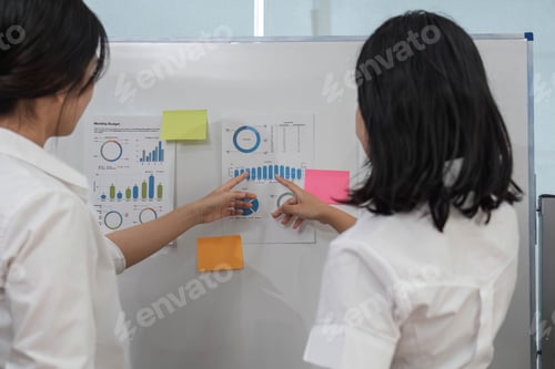 Preview: Casual creative happy two smile asian business people plan strategy analysis and brainstorm putting