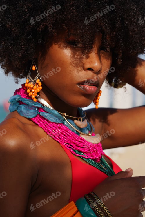 Preview: African black woman with Afro hair wearing colorful jewelry