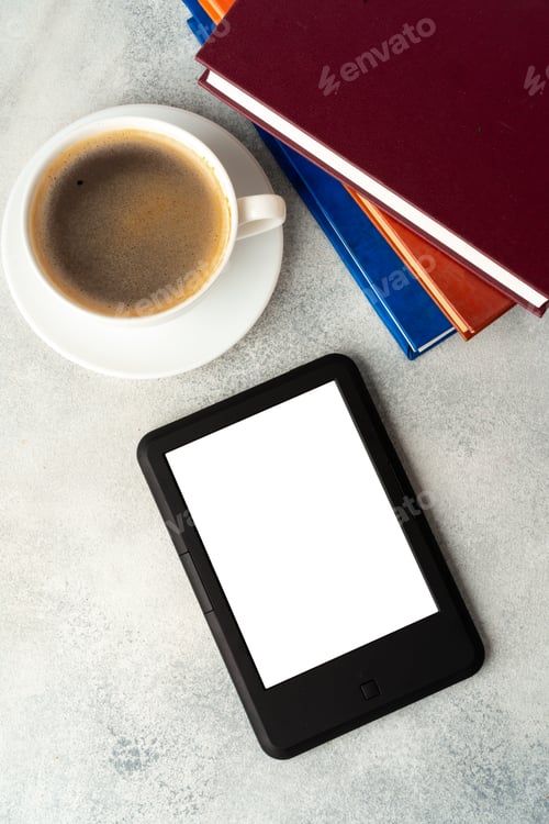 Preview: Composition with modern e-book reader, hardcover book and cup of coffee on table