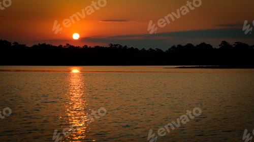 Preview: Idyllic beach scene at sunset with a tranquil sky and soft waves in Destin, Florida
