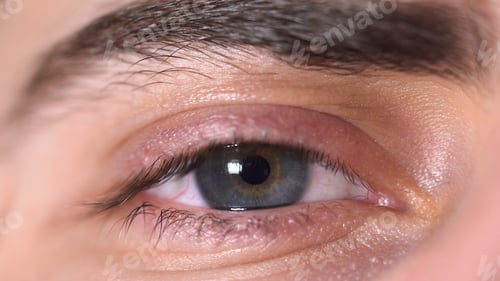 Preview: Extreme close up of a beautiful blue man eye looking straight and then looking up, human body