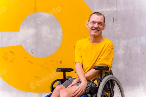 Preview: A disabled person in a wheelchair with a cement wall