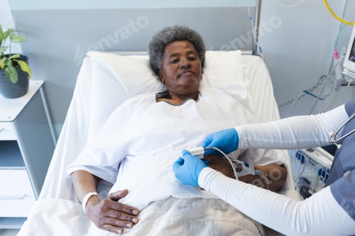 Preview: Senior African American woman in a hospital bed, with copy space
