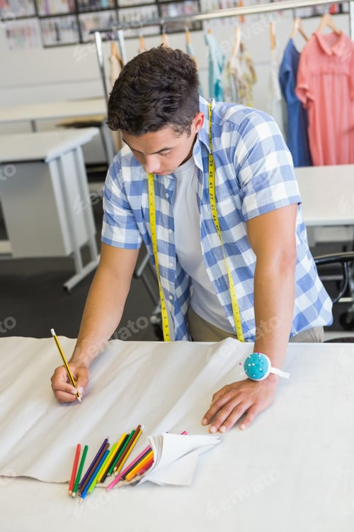 Preview: Fashion student drawing patterns at the college