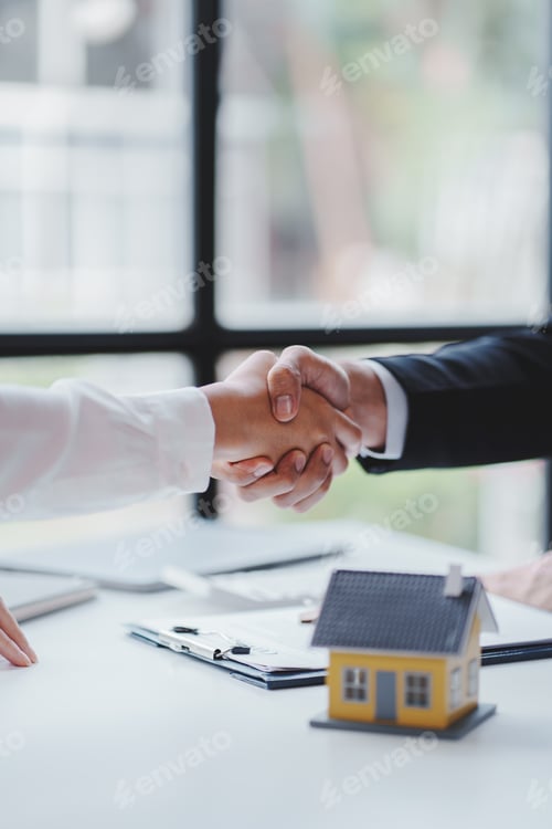 Preview: Handshake real estate agents deliver sample homes to customers. mortgage loan agreement Make a contr