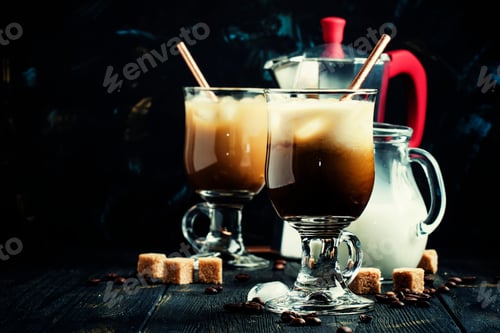 Preview: Ice coffee in glasses on a dark background, selective focus