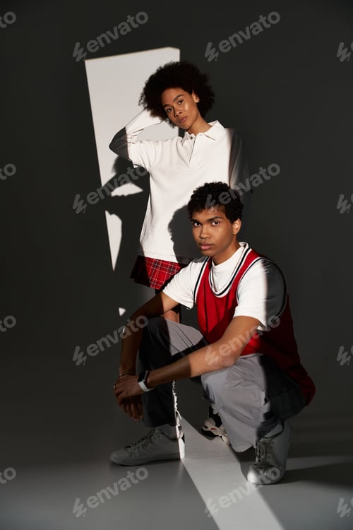 Preview: Stylish young couple showcases love and connection in striking contrast of light and shadow