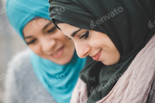 Preview: Close up of two young women wearing hijabs